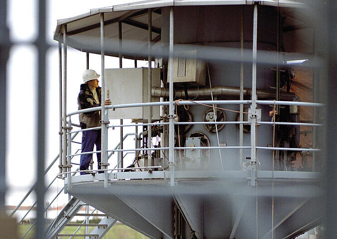 WESSLING air monitoring technician checks dust measuring device.  