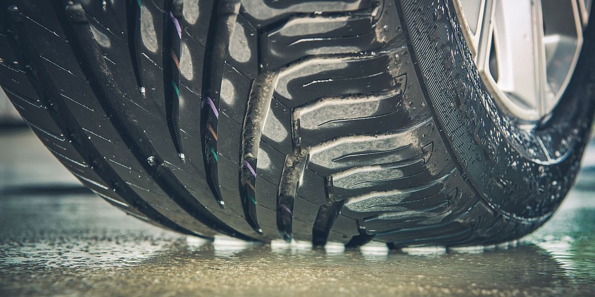 Car tyres on a wet road 